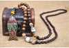 Collier "Symbole Bouddhiste Tibétain" en Bois Naturel - 9 modèles disponibles