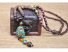 Collier "Symbole Bouddhiste Tibétain" en Bois Naturel - 9 modèles disponibles