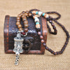 Collier "Symbole Bouddhiste Tibétain" en Bois Naturel - 9 modèles disponibles