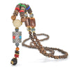 Collier "Symbole Bouddhiste Tibétain" en Bois Naturel - 9 modèles disponibles