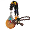 Collier "Symbole Bouddhiste Tibétain" en Bois Naturel - 9 modèles disponibles