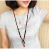 Collier "Symbole Bouddhiste Tibétain" en Bois Naturel - 9 modèles disponibles