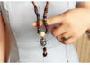 Collier "Symbole Bouddhiste Tibétain" en Bois Naturel - 9 modèles disponibles